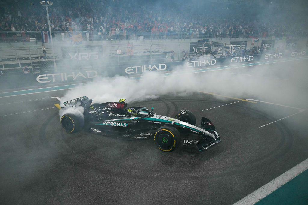 Mercedes driver Lewis Hamilton carries out a doughnut manoeuvre at the end of the Abu Dhabi Grand Prix at the Yas Marina Circuit, Abu Dhabi