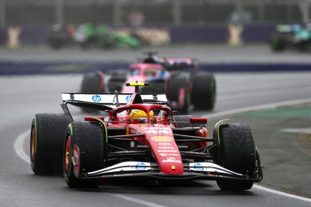 Lewis Hamilton drives his Ferrari during the Australian Grand Prix with Alpine's Esteban Ocon behind him