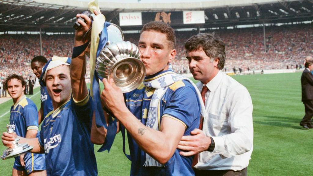 Wimbledon FC midfielder Vinnie Jones kisses the FA Cup at Wembley