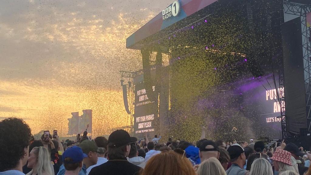 Confetti fills the air as Fatboy Slim takes to the stage