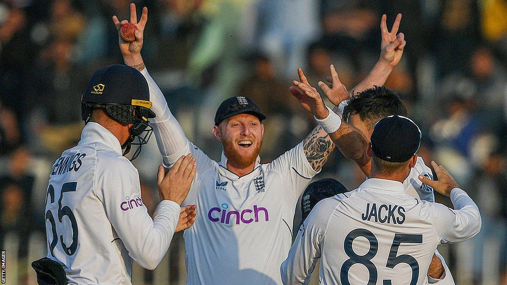 Ben Stokes (centre) and his England team-mate celebrate a wicket against Pakistan