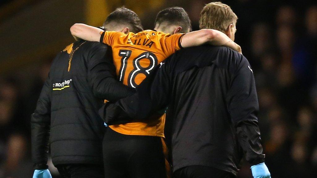 Diogo Jota is helped from the field during Wolves' win over Reading