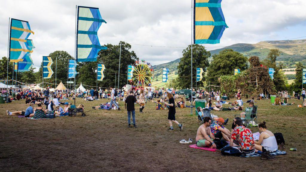 Crowds gather on the field at the Green Man festival