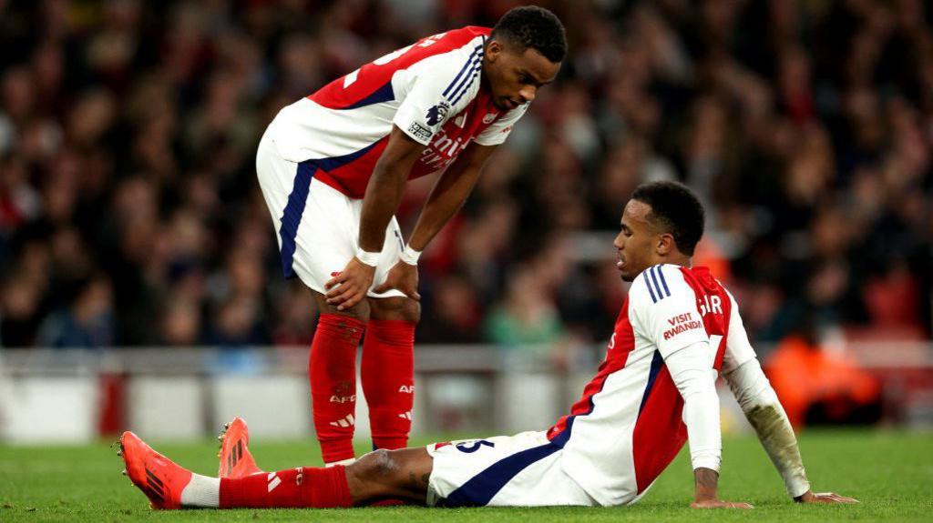 Arsenal's Gabriel sits on the pitch injured