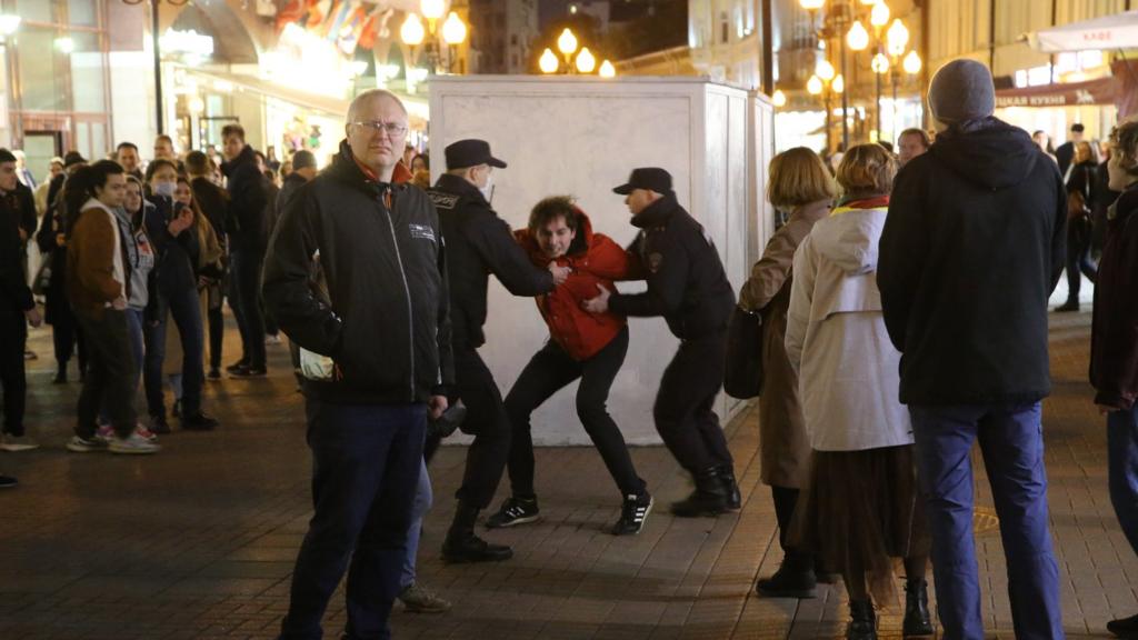 Russian Police officers detain a protester during an unsanctioned protest rally at Arbat street on September 21, 2022 in Moscow, Russia.