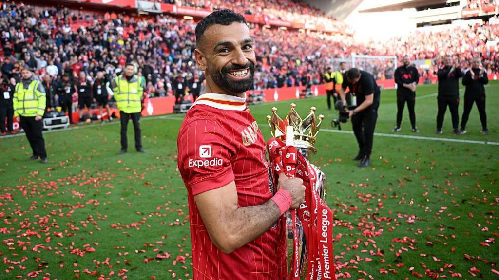 Mohamed Salah with the Premier League trophy at Anfield