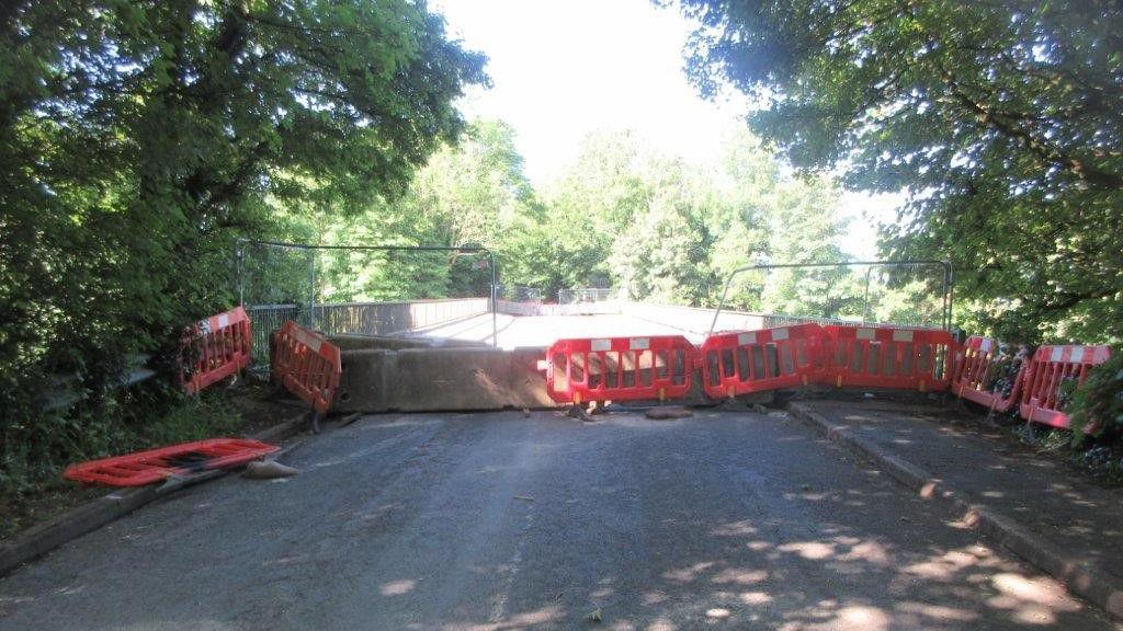 Damaged barriers at one of the road closures