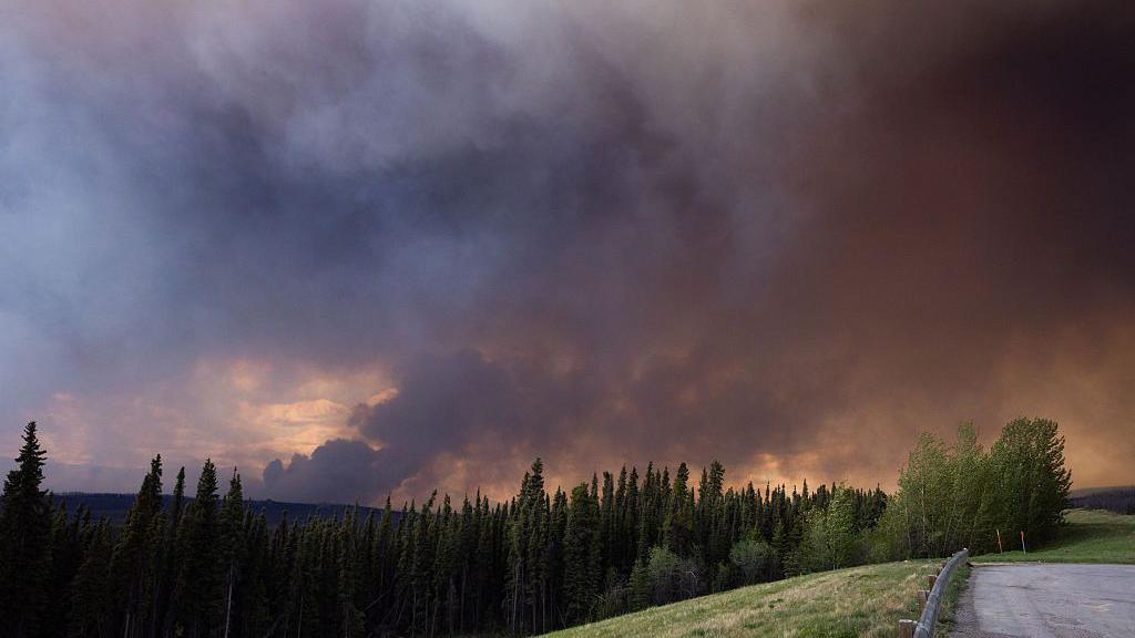 Wildfire smoke above Highway 97, north of the Buckinghorse River near Trutch, British Columbia, Canada, on Friday, May 30, 2025.