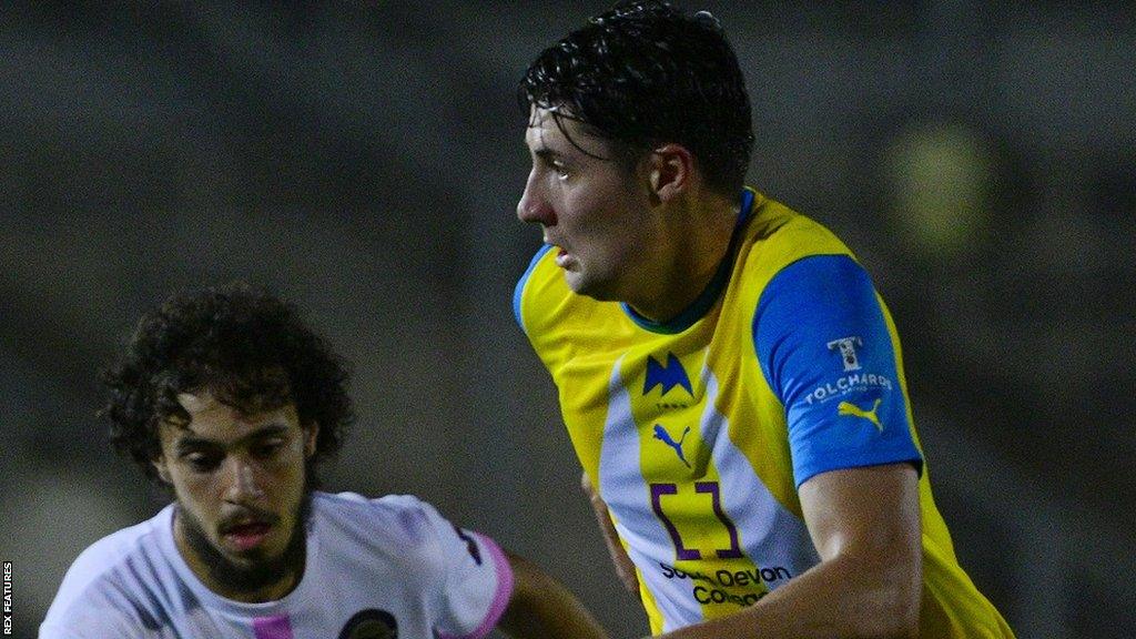 Brett McGavin playing for Torquay United