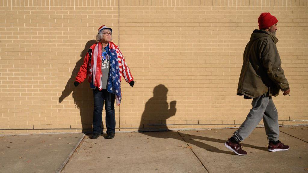 Supporters of former US President and Republican presidential candidate Donald Trump arrive at a campaign rally at the Santander arena in Reading, Pennsylvania, on November 4, 2024.