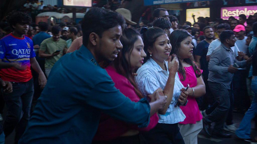 Fans of the Royal Challengers Bengaluru (RCB) react outside the the M. Chinnaswamy Stadium on June 04, 2025 in Bengaluru, India.