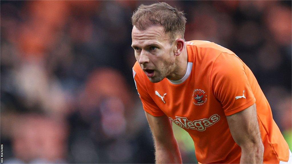 Jordan Rhodes looks dejected whilst playing for Blackpool