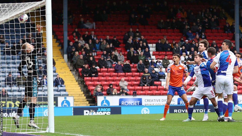 Swansea's Nathan Wood watches on as Ben Cabango's first-half header hits the bar