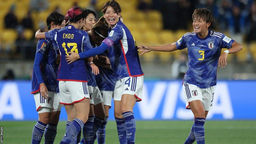 Japan celebrate beating Spain