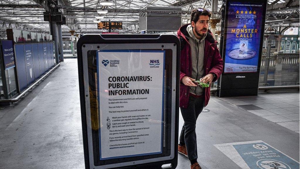 Man walks through deserted Edinburgh Waverely