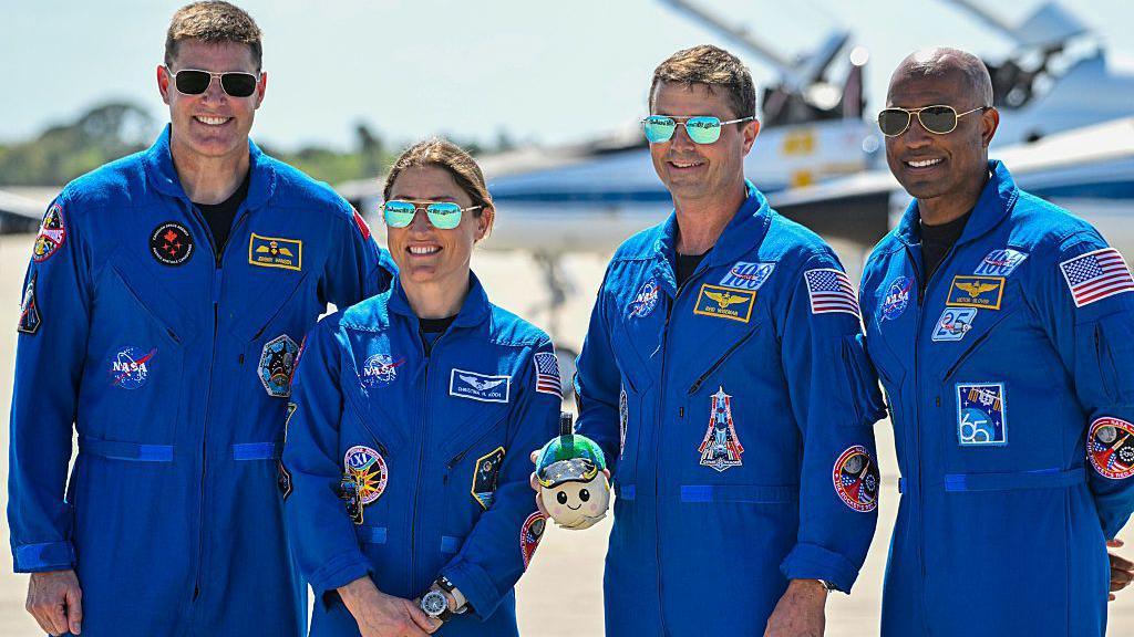 Canadian Space Agency astronaut Artemis II Mission Specialist Jeremy Hansen, NASA astronaut and Artemis II Mission Specialist Christina Koch, NASA astronaut and Artemis II Commander Reid Wiseman and NASA astronaut and Artemis II pilot Victor Glover look on during a welcome ceremony ahead of the Artemis II April 1 launch at Kennedy Space Center in Florida on March 27, 2026. 