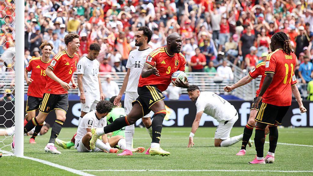 Romelu Lukaku carries the ball back to the centre circle after helping force an own goal to equalise for Belgium against Egypt at the 2026 World Cup