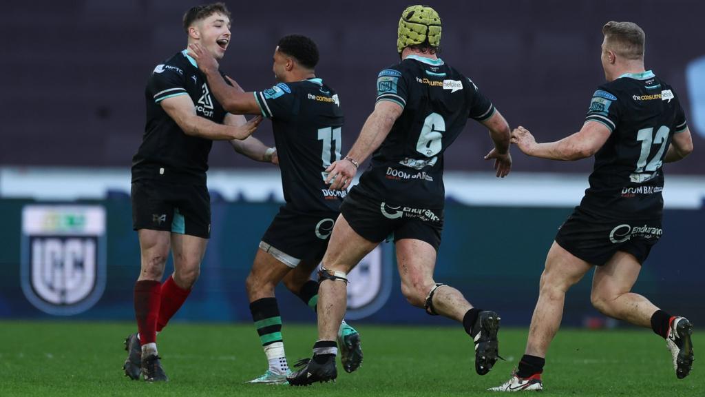 Dan Edwards (L) celebrates with Ospreys team-mates Keelan Giles, Harri Deaves and Keiran Williams