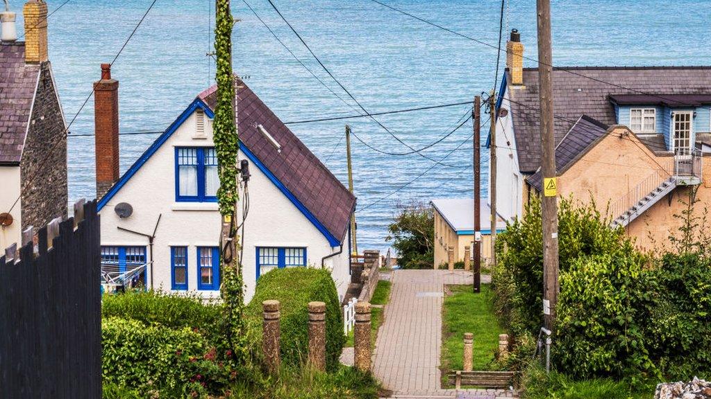 The path between houses leading down to Tresaith beach in Ceredigion