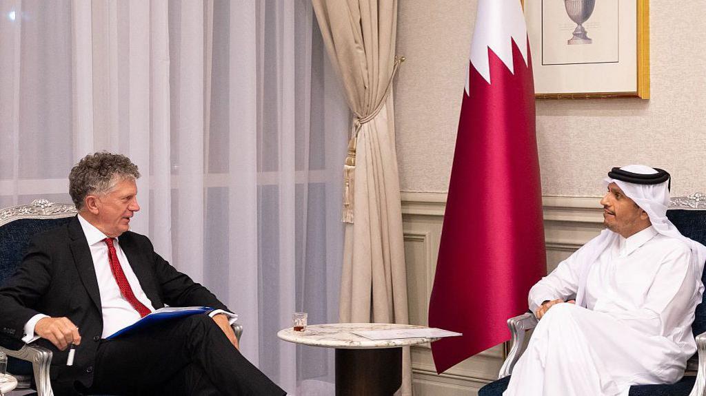 Jonathan Powell sitting opposite Qatar's Prime Minister and Foreign Minister Mohammed bin Abdulrahman bin Jassim Al-Than