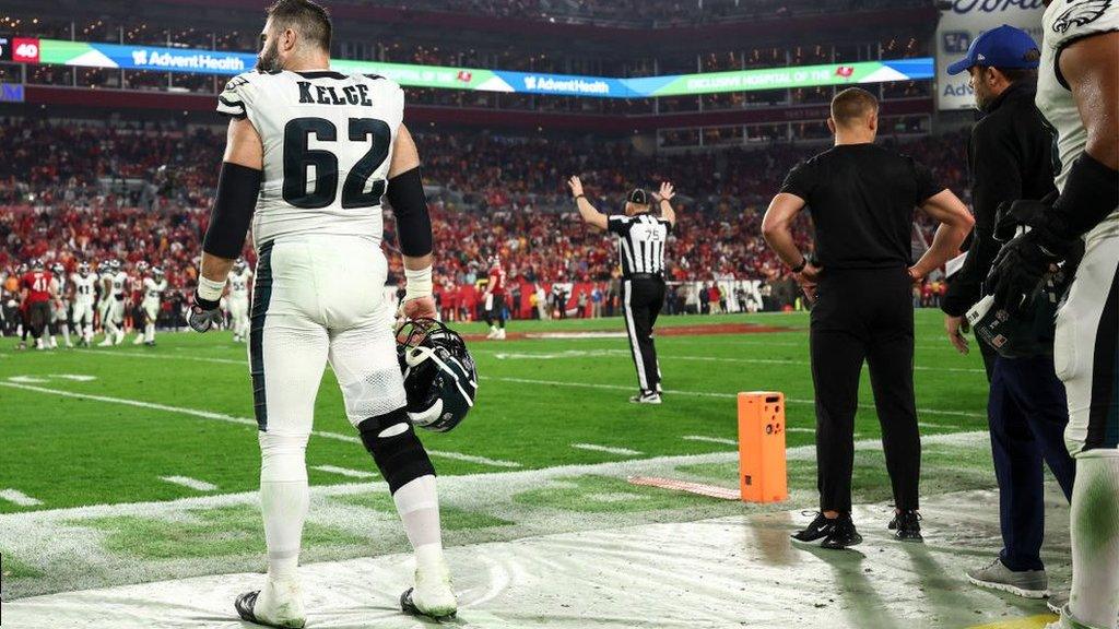 Jason Kelce watches on from the side of the field