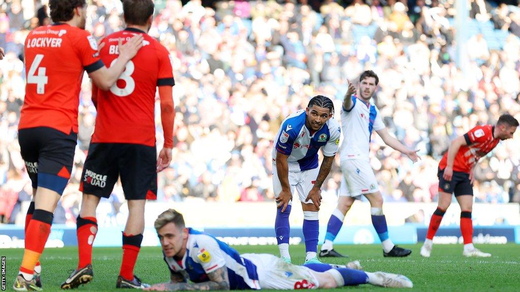 Sam Szmodics lies flat out after failing to score, as Tyrhys Dolan and Joe Rankin-Costello look on