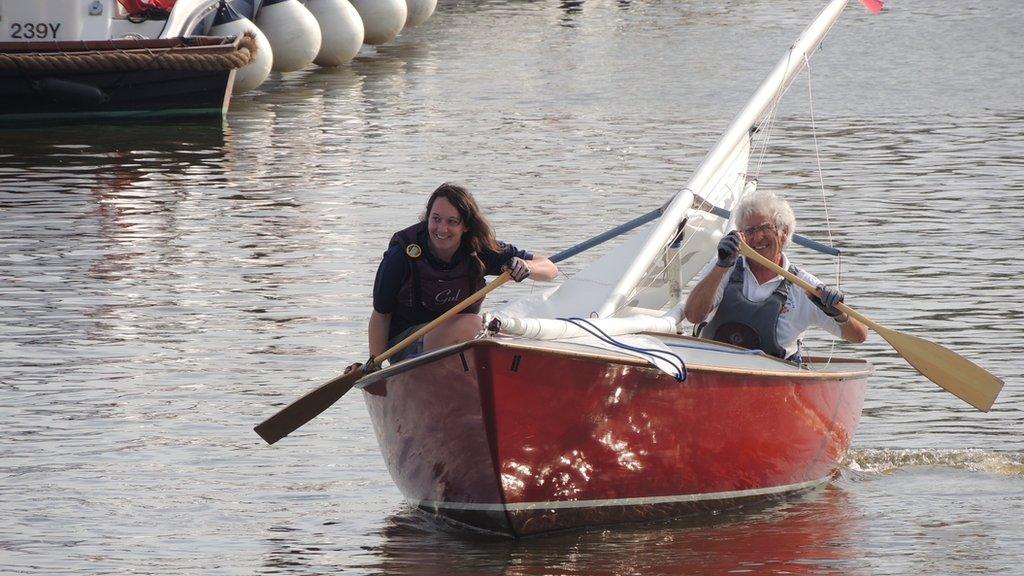 Holly and her dad competing in the boat race