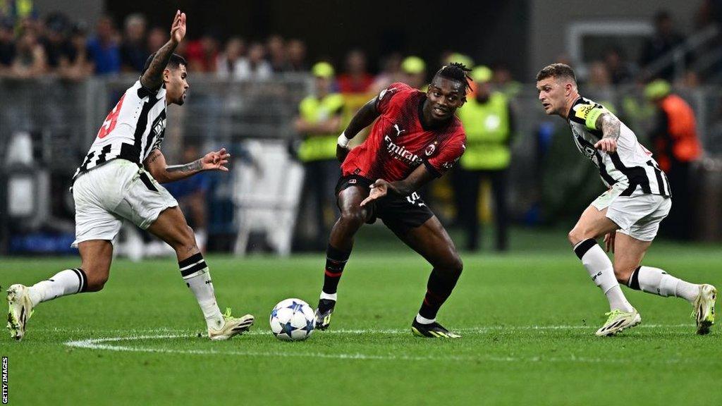 Rafael Leao fights for the ball with Newcastle United's Brazilian midfielder Bruno Guimaraes