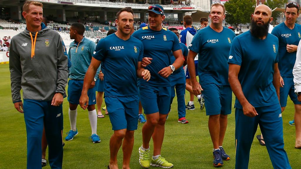 Hashim Amla leads the South African team off