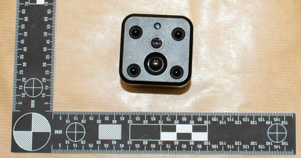 spy camera shown in evidence next to tape measure