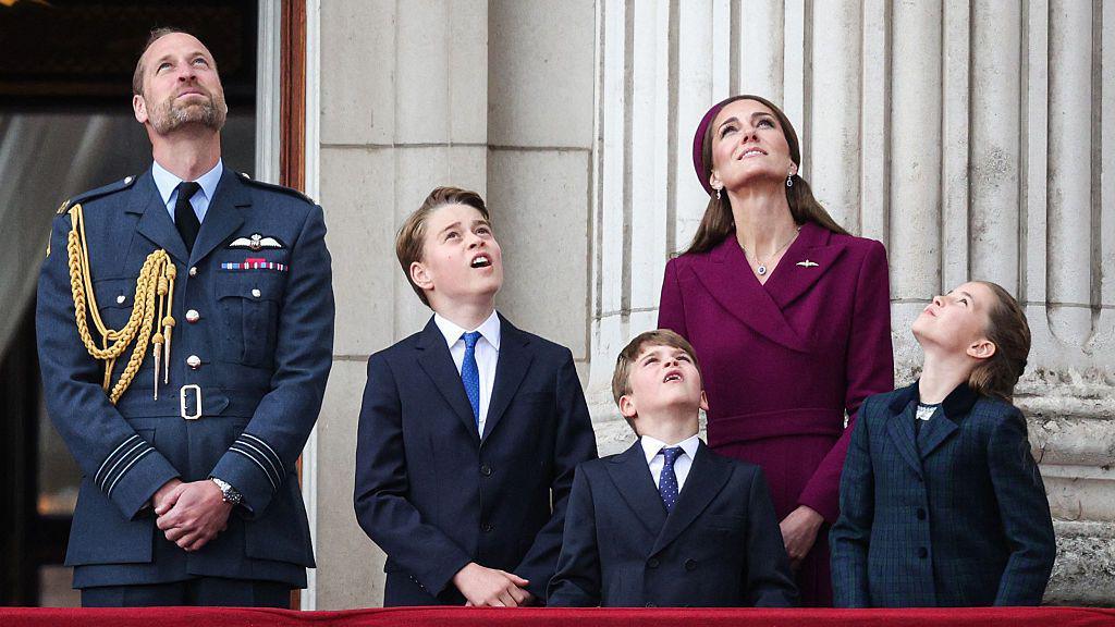 Prince William, Princess Catherine and the 3 royal children watch the Red Arrows flypast from Buckingham Palace balcony after attending the armed forces procession on May 5, 2025 to celebrate the 80th anniversary of VE Day
