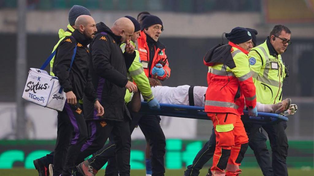 Moise Kean being taken off on a stretcher