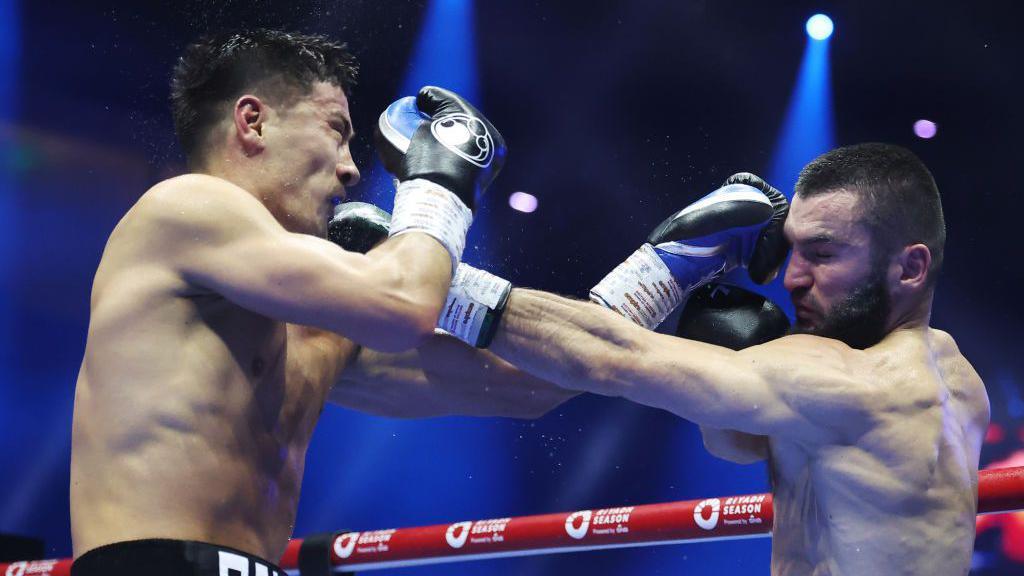 Dmitry Bivol and Artur Beterbiev both punch each other