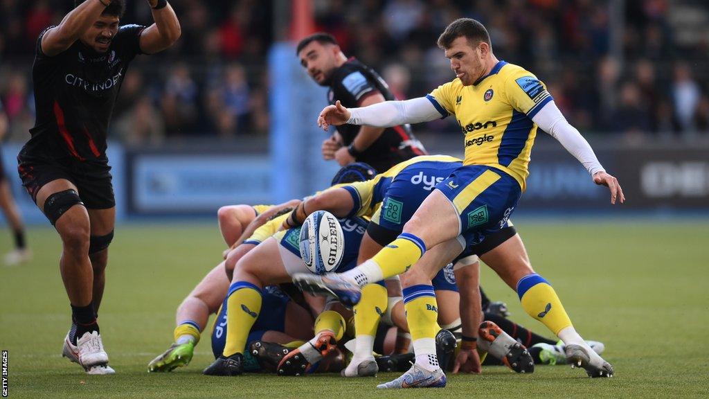 Ben Spencer kicks the ball for Bath