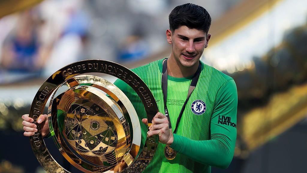 Mike Penders holding the Club World Cup trophy