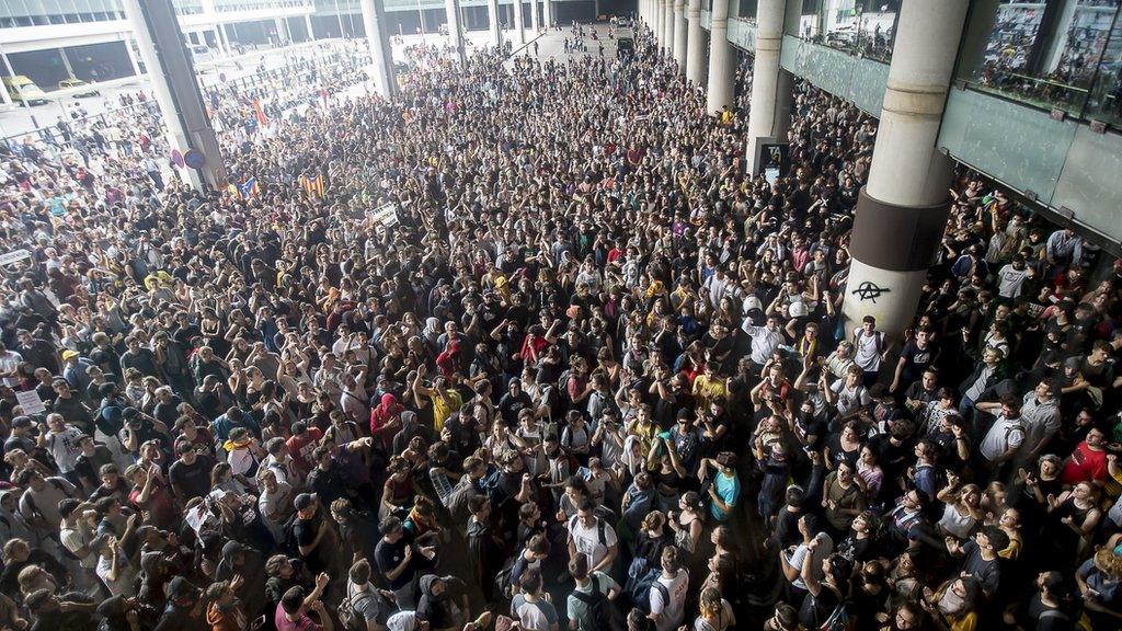 Thousands of Catalonia pro-independence activists occupy Barcelona airport.