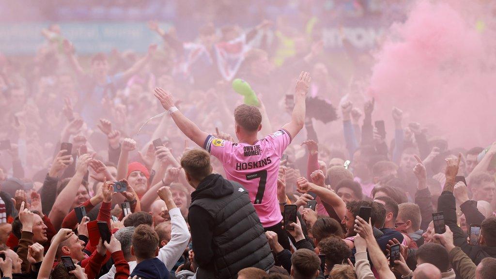 Sam Hoskins leads the promotion celebrations for Northampton Town