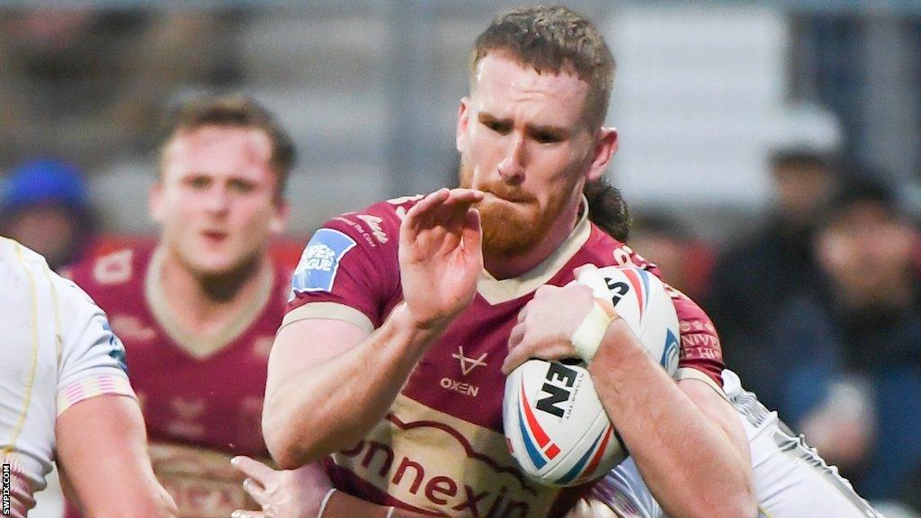 Rowan Milnes tries to evade a tackle against Catalans Dragons