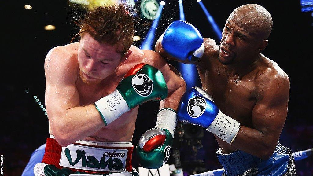 Floyd Mayweather connects with a punch on Saul 'Canelo' Alvarez