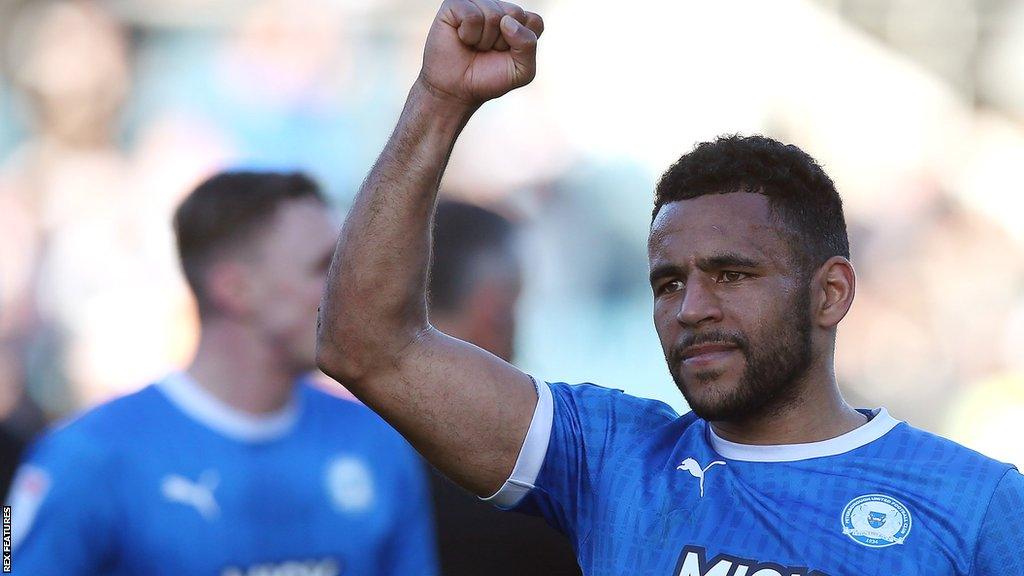 Peterborough's Nathan Thompson punches the air after a game