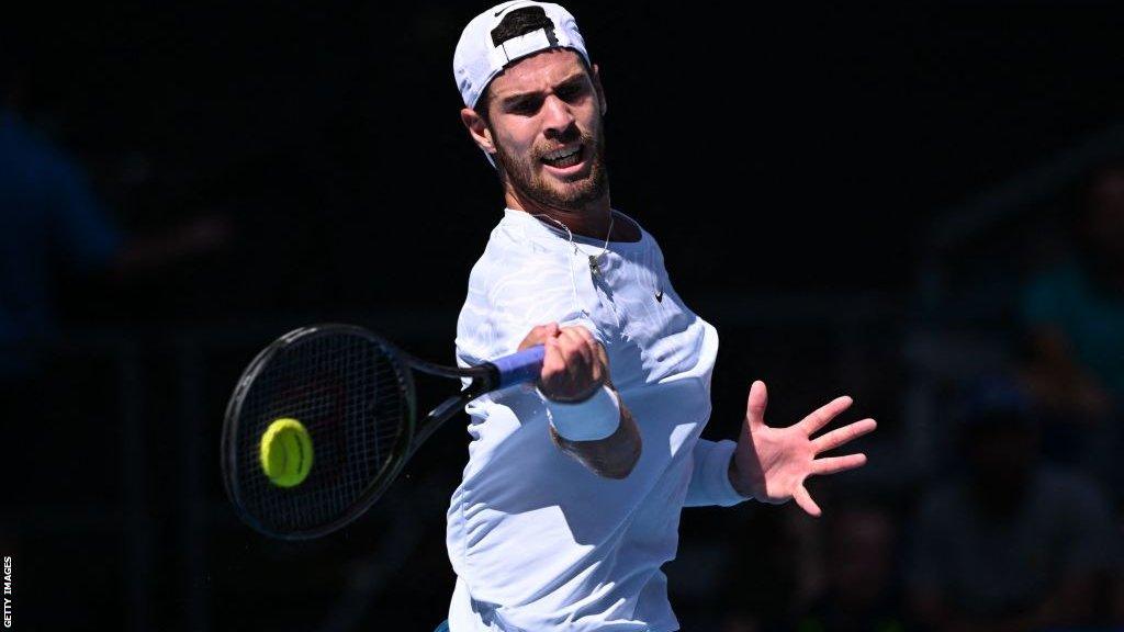 Karen Khachanov strikes the ball