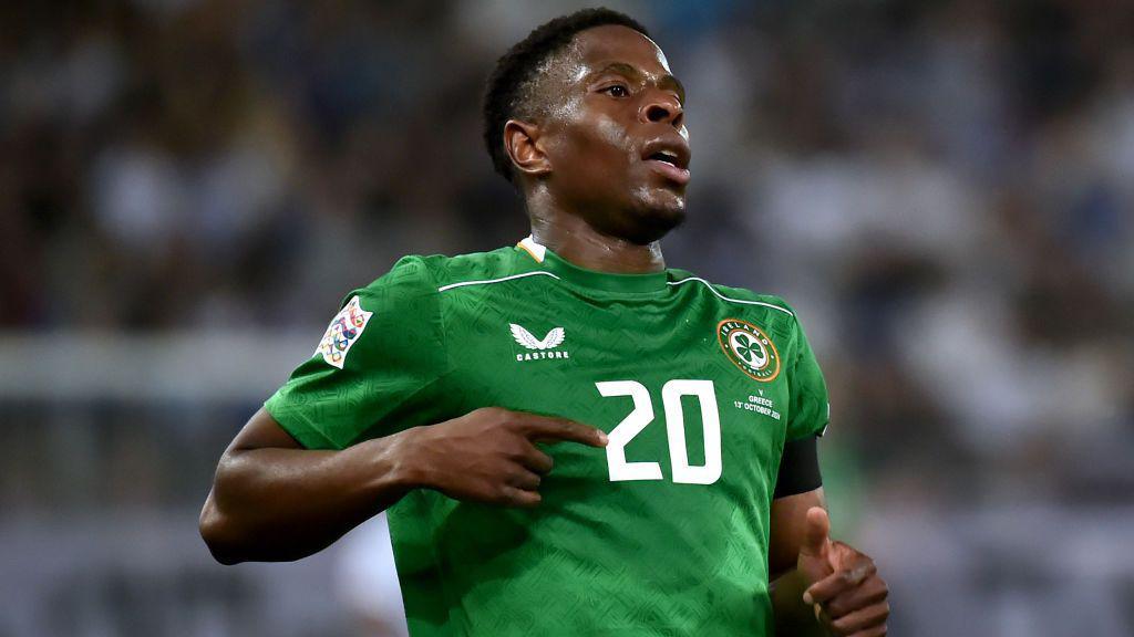 Chiedozie Ogbene wearing his Republic of Ireland kit during a match.