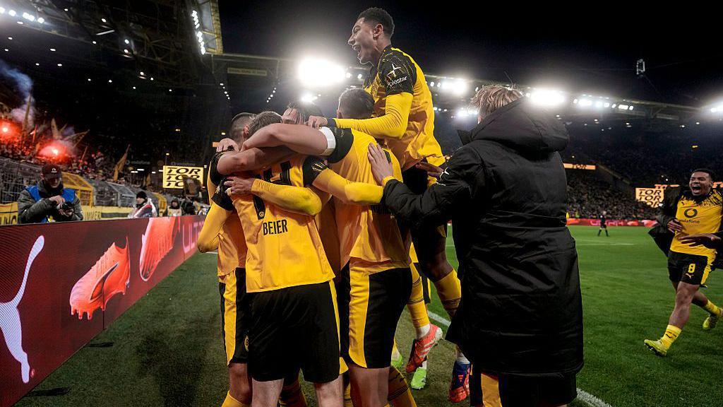 Borussia Dortmund celebrate a last minute winner against Koln.