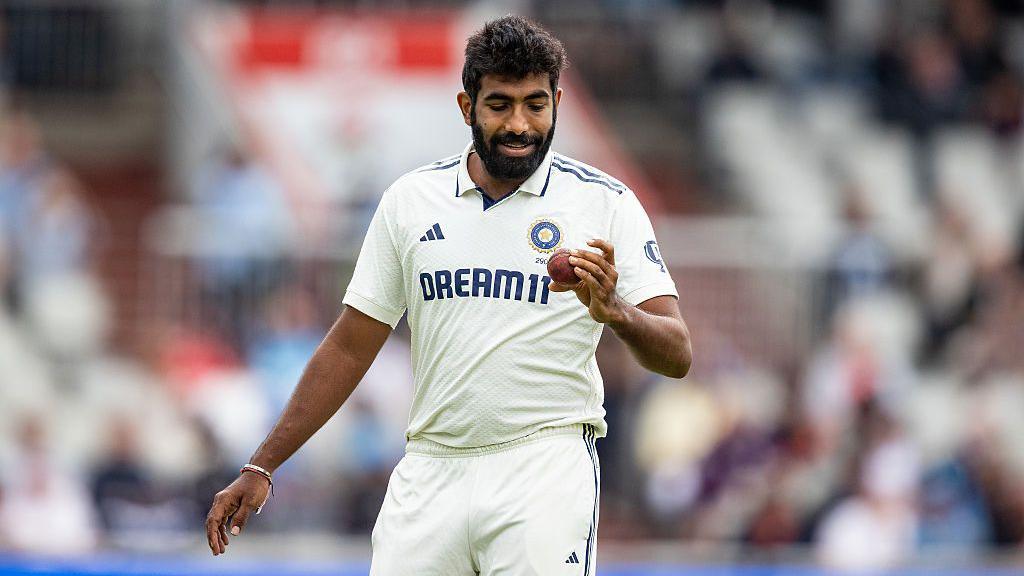 Jasprit Bumrah looks at the ball