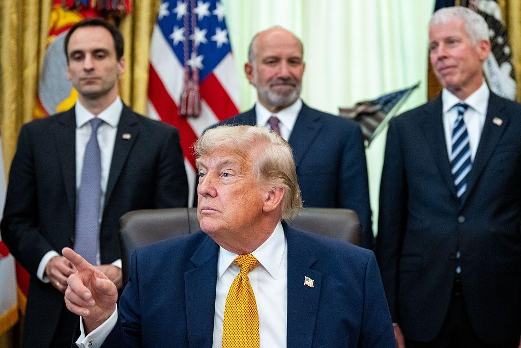 Michael Kratsios, director of the White House Office of Science and Technology Policy, from left, US President Donald Trump, Howard Lutnick, US commerce secretary, and Chris Wright, US energy secretary, during an executive order signing in the Oval Office of the White House in Washington, DC, US, on Monday, June 22, 2026. 