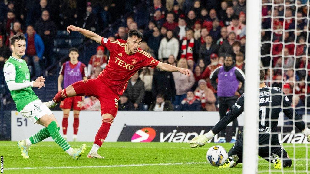 Bojan Miovski slots his shot past David Marshall to send Aberdeen into the final