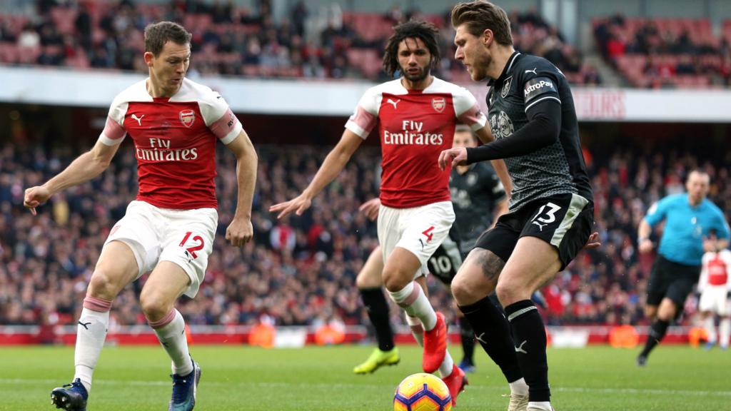 Stephan Lichtsteiner and Mohamed Elneny