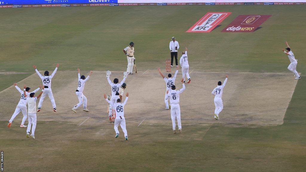 England celebrate winning in Rawalpindi