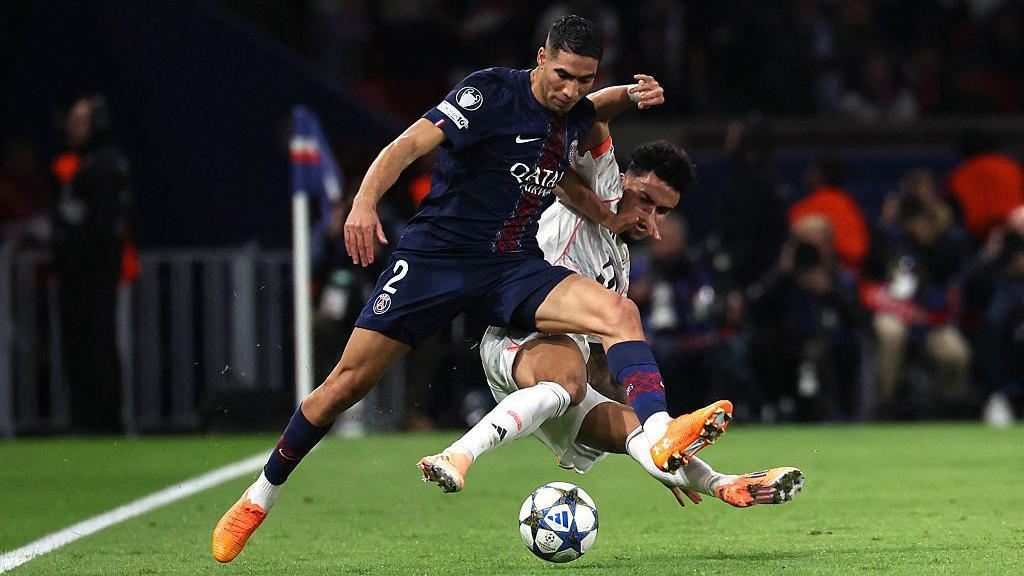 Bayern Munich forward Luis Diaz tackles Paris St-Germain full-back Achraf Hakimi