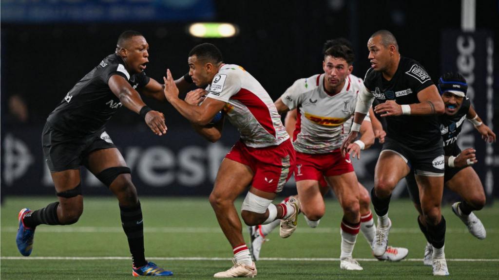 Harlequins' Will Joseph tries to beat the Racing defence